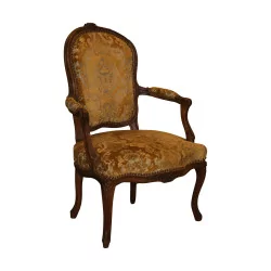 Louis XV convertible covered in yellow fabric, backrest at the