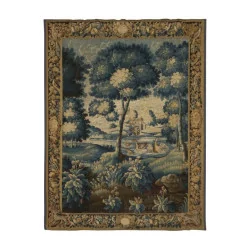 “Verdure” tapestry, representing a river landscape with …