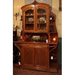 Art-Nouveau dining room in walnut carved with bunches of grapes,