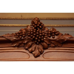 Art-Nouveau dining room in walnut carved with bunches of grapes,