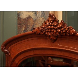 Art-Nouveau dining room in walnut carved with bunches of grapes,