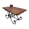 Butcher’s table with wooden top standing with the center in … - Moinat - Dining tables