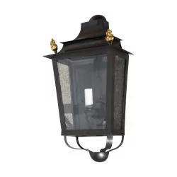 Wall light in black bronze with golden flames.