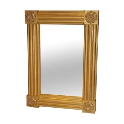 Golden rectangular mirror, fluted with rosettes in the …