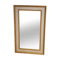 white and gold rectangular mirror.