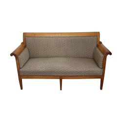 Canapé Directoire, recouvert de tissu à rayures fleuries.