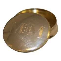 Petite boite ronde (à pillules) avec inscription sur le