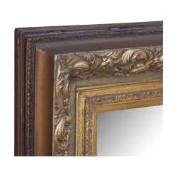 Mirror with richly carved gilt stucco frame. 20th century