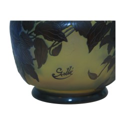 Vase signed Gallé with blue clematis decoration on a yellow background, …