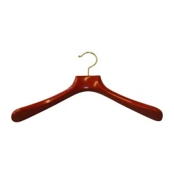 Hanger in matt red lacquered wood