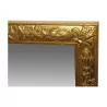 Miroir en bois sculpté finition doré avec glace biseautée. - Moinat - Glaces, Miroirs