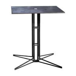 Raw metal table with bistro-style metal top.
