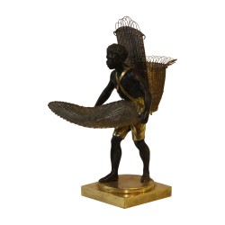 Bronze (nubien) "Porteur noir" patiné sur socle. Fabrication