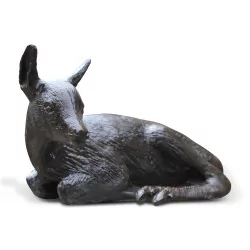 Bronze statue of a lying fawn.