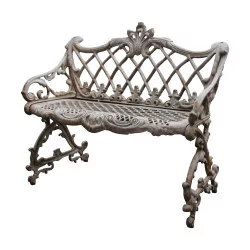Cast iron garden bench painted ivory.