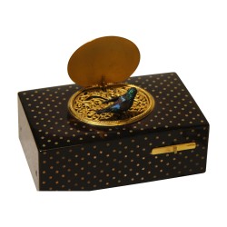 Songbird in a tortoiseshell box with …