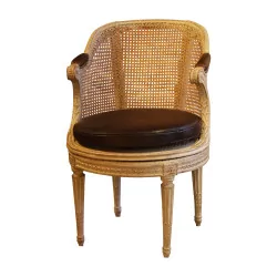 Louis XVI caned armchair with rotating seat, in …