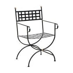 Armchair in wrought iron painted black with slats.