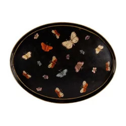 Sheet metal tray painted with butterflies on a black background.