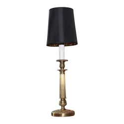 Bronze lamp with ornament and black lampshade and interior …