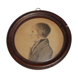 wooden frame with watercolor of a left profile on paper,
