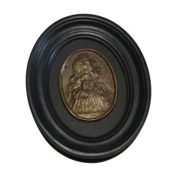 个椭圆形徽章，上面印有奥地利查理六世的肖像……