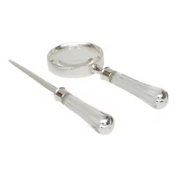 Box of letter openers and magnifying glass with transparent handle