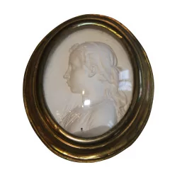Medallion left profile of a young girl in plaster with frame in …