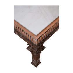 Living room table in patinated carved wood with white marble.