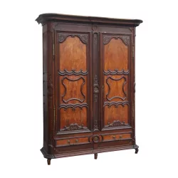 Cabinet richly carved in oak and light wood, with …