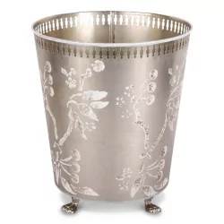 Wastepaper basket in silver painted sheet metal with floral decoration.