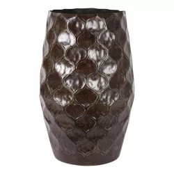 Brown metal flowerpot with carved decoration.