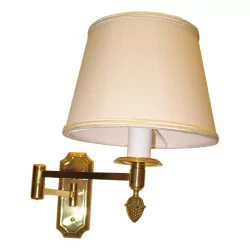 Articulated brass wall lamp with white lampshade.