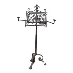 wrought iron lectern, with lilies and 2 candlesticks.