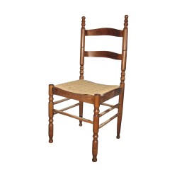 Modern straw chair in stained and varnished beech.