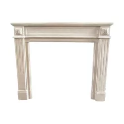 Louis XVI style fireplace in carved limestone.