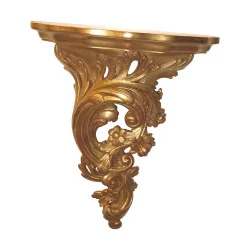 Small wall console in carved and gilded wood.