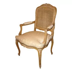 Louis XV style armchair in carved and patinated beech,