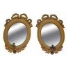 Pair of oval-shaped Louis XVI mirrors gilded with fine gold. - Moinat - Mirrors