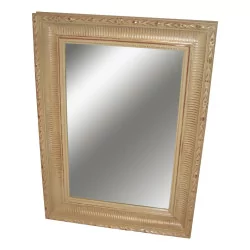 cream colored fluted mirror.