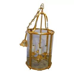 round lantern with 4 lights in gilded and chiseled bronze.