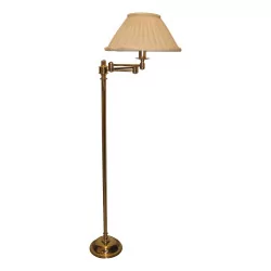 articulated brass floor lamp with pleated lampshade.