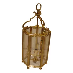 Lanterne de style Louis XVI en bronze ciselé à 4 lumières.
