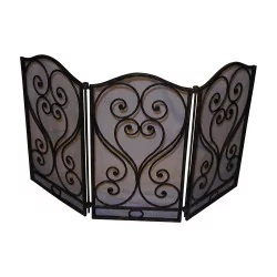 Wrought iron firewall with 3 shutters.