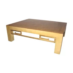 golden living room table with cube marquetry on top.
