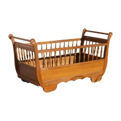Child's bed, cradle in cherry wood on brass wheels, …