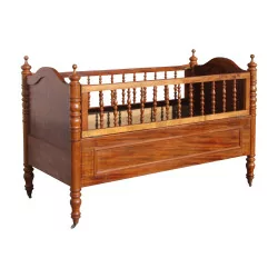 child's bed - baby in walnut on small brass wheels, …