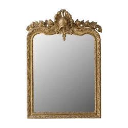 Régence mirror, in carved and gilded wood, with …