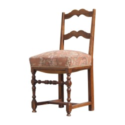 wooden chair covered with floral fabric, in the state. 20th …