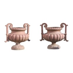 Pair of cast iron vases on the CORNEAU plinth...